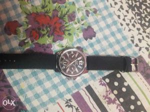 Round Black And Silver Chronograph Watch With Black Strap
