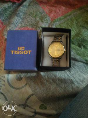 Round Roman Numeral Tissot Watch With Silver Strap In Box