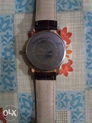 Round Silver Watch With White Leather Band
