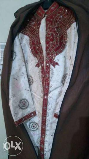 White sherwani with red design full size used,/