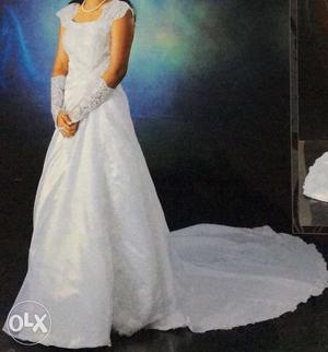 White wedding gown with gloves and bakram. Gown