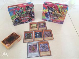 75 yu gi oh cards with two tins