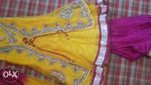 Beautiful pink and yellow color net suit. One