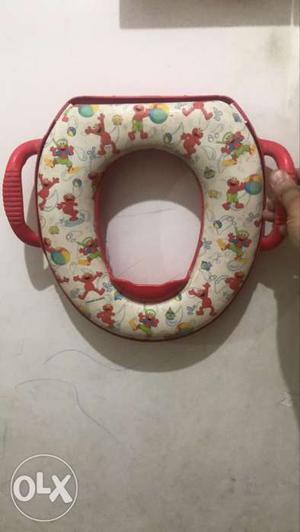 Beige And Red Potty Seat