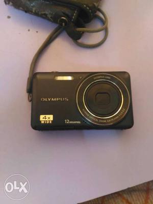 Black Olympus Digital Camera with pouch charger and sd card