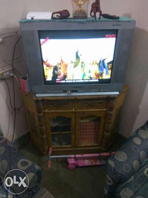 Brown Wooden TV Stand; Grey CRT Television