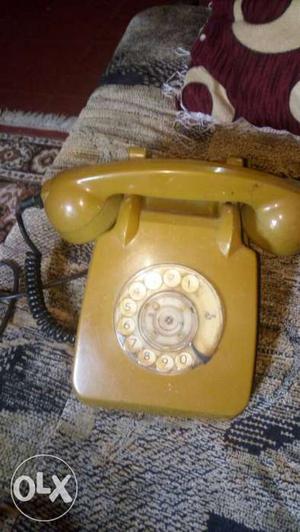 Golden yellow rotary dial land phone good working