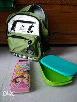 Green And Gray Backpack And Green Plastic Containr