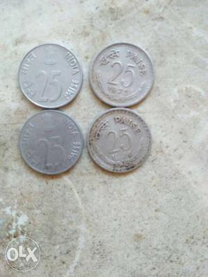 Four Round Grey 25 India Paise Coins
