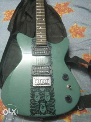 Green And Black Electric Guitar