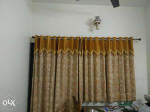 Many sets of window and door curtains available
