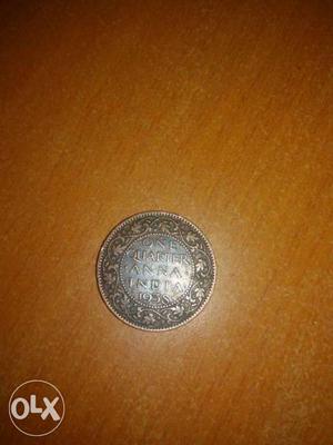 One quarter anna india coin  year.