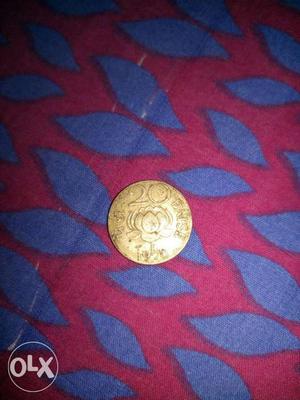  year gold round antique coin..