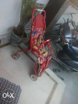 Baby's Red Stroller