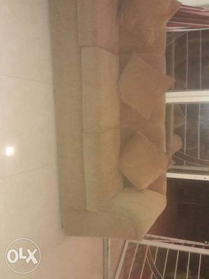 Brown Couch With Throw Pillow