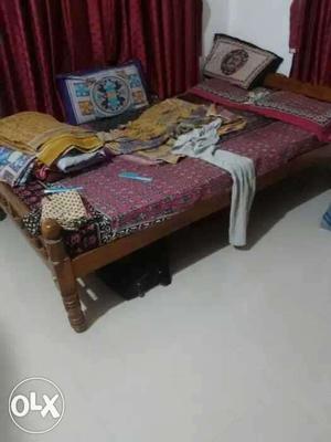 Brown Wooden Bed With Red Mattress.. size 6 * 4.. 2years