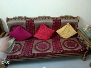 Brown Wooden Sofa With Red Pad