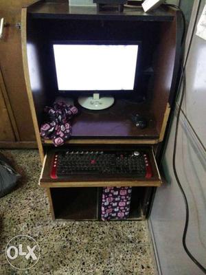 Computer Set On Brown Wooden Computer Hutch