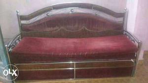 Grey Metal Base Red Padded Sofa