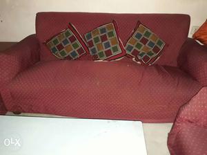 Red Suede Futon With Three Throw Pillows