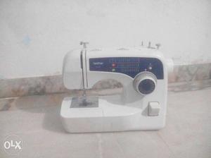 White And Blue Brother Sewing Machine