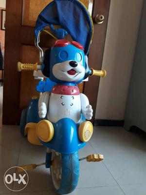 White, Blue And Yellow Tricycle Ride On Toy