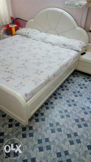 White bed with mattresses