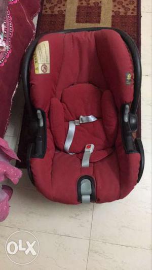 Baby's Red, Black, And Gray Car Booster Seat