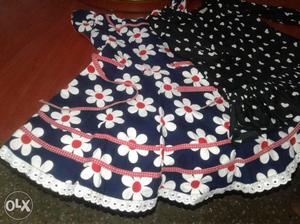 Pair of dresses for baby girls.