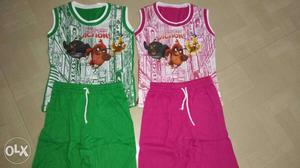 Two White, Green And Pink Tank Tops And Drawstring Shorts