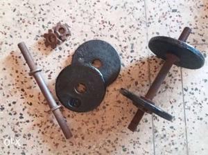 2 iron dumbells. 4 plates of 10kg each. Good for
