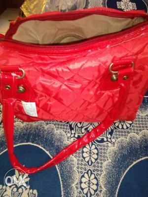 Beautiful hot red unused handbag with sufficient