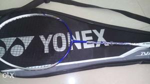 Blue And White Yonex Badminton Racquet With Black Leather