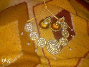 Gold-and-brown Collar Necklace And Jhumka Earrings