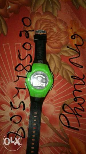 Green And Black Round Digital Watch With Black Strap