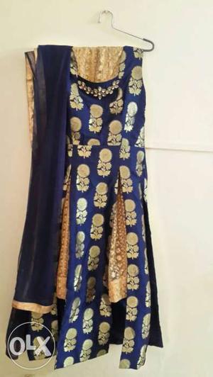 Long blue designer top with golden skirt and a