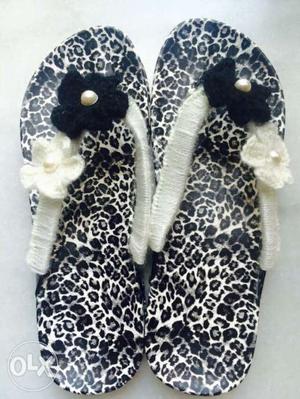 Pair Of Black And White Flipflops