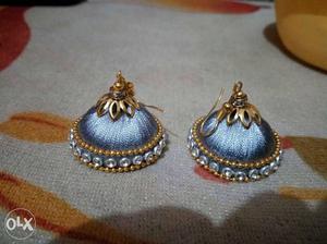 Pair Of Blue And Gold Polished Silk Thread Jhumkas Earrings