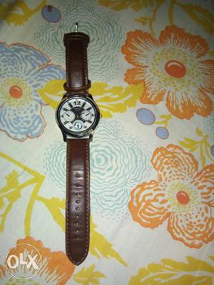 Round White Face Chronograph Watch With Brown Leather Strap