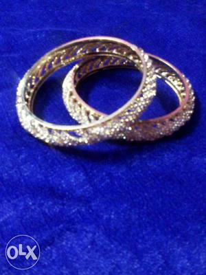 Two Gold covering And Diamond Clustered Rings