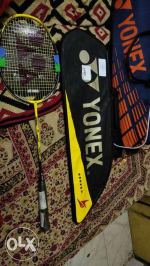 Yellow And Black Yonex Badminton Racket With Black And