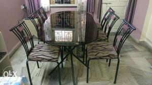6 seater dinning table with purple upholstery in