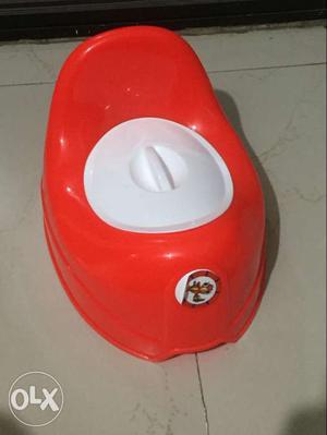 A new unused potty teainer for kids. bright