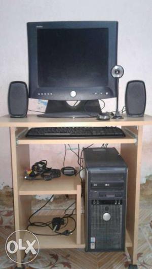 Black CRT Monitor, Speakers, Keyboard, And Computer Tower