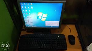 Black Corded Computer Keyboard. Monitor, And Mouse