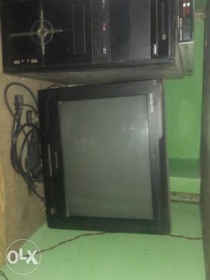 Black Flat Screen Monitor And Black Computer Tower