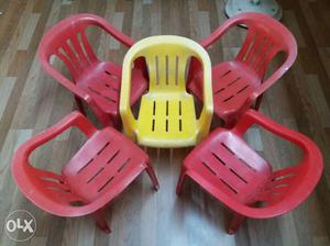Four Red One Yellow Baby Armchairs in good condition.