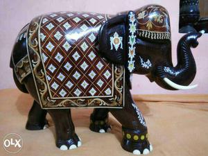 Fully inlayed elephant with right leg front,
