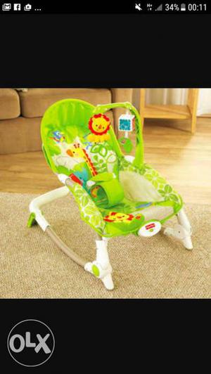 Green And White Fisher Price Bouncer Seat