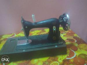 Hand sewing machine of merrit company. with cover